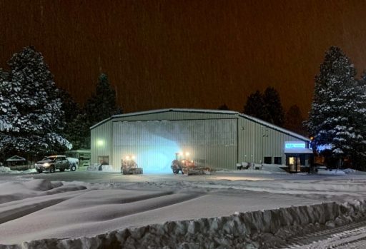 Steel building surrounded by snow | Wind Speed and Snow Loads