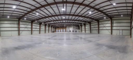 Inside of an ice rink that has use steel for its structure