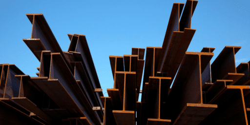 Close-up view of metal beams forming the structural framework in the early stages of restaurant construction.